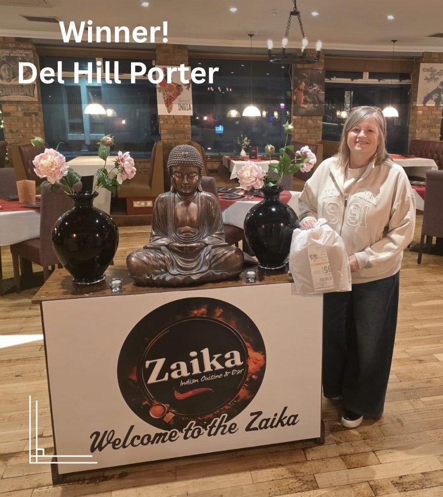 A woman wins Zaika Restaurant Giveaway Award in Dumbarton.